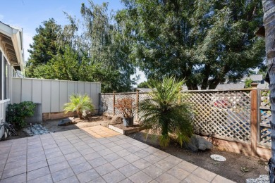 Light-filled townhouse featuring a kitchen with granite counters on Ridgemark Golf and Country Club in California - for sale on GolfHomes.com, golf home, golf lot