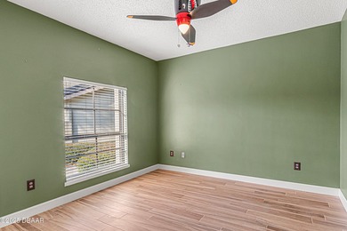 Enjoy fantastic golf course scenery from this Wedgewood property on Spruce Creek Golf Club in Florida - for sale on GolfHomes.com, golf home, golf lot