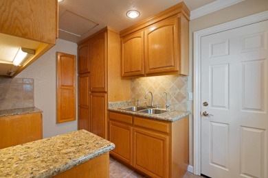 Light-filled townhouse featuring a kitchen with granite counters on Ridgemark Golf and Country Club in California - for sale on GolfHomes.com, golf home, golf lot