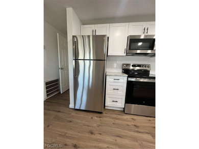 Come make this beautifully remodeled home YOURS!!!. NEW FLOORS on Six Lakes Country Club in Florida - for sale on GolfHomes.com, golf home, golf lot