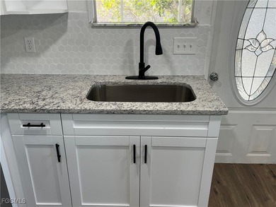 Come make this beautifully remodeled home YOURS!!!. NEW FLOORS on Six Lakes Country Club in Florida - for sale on GolfHomes.com, golf home, golf lot