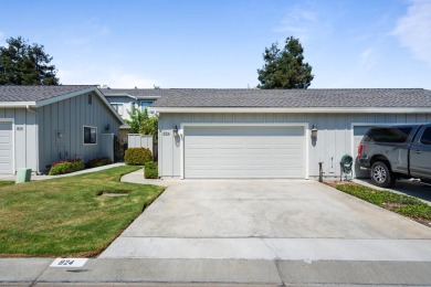 Light-filled townhouse featuring a kitchen with granite counters on Ridgemark Golf and Country Club in California - for sale on GolfHomes.com, golf home, golf lot