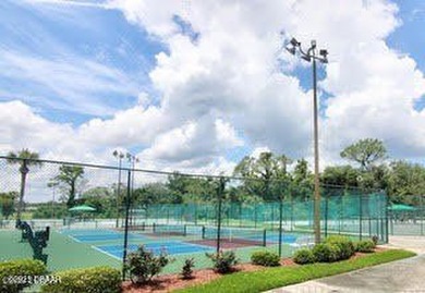 Enjoy fantastic golf course scenery from this Wedgewood property on Spruce Creek Golf Club in Florida - for sale on GolfHomes.com, golf home, golf lot