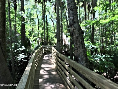 Enjoy fantastic golf course scenery from this Wedgewood property on Spruce Creek Golf Club in Florida - for sale on GolfHomes.com, golf home, golf lot