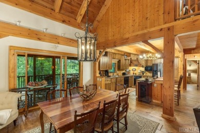 This beautiful, fully furnished, 3-bedroom, 2.5-bath wood cabin on Sapphire National Golf Club in North Carolina - for sale on GolfHomes.com, golf home, golf lot