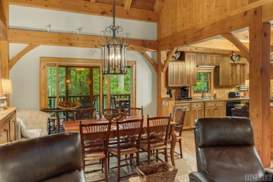 This beautiful, fully furnished, 3-bedroom, 2.5-bath wood cabin on Sapphire National Golf Club in North Carolina - for sale on GolfHomes.com, golf home, golf lot