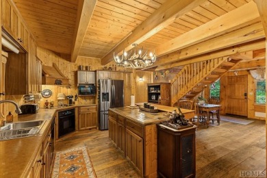 This beautiful, fully furnished, 3-bedroom, 2.5-bath wood cabin on Sapphire National Golf Club in North Carolina - for sale on GolfHomes.com, golf home, golf lot