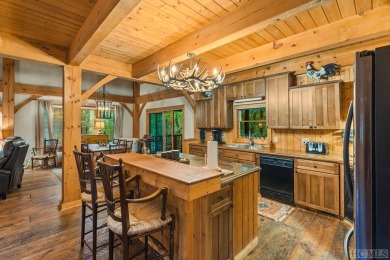 This beautiful, fully furnished, 3-bedroom, 2.5-bath wood cabin on Sapphire National Golf Club in North Carolina - for sale on GolfHomes.com, golf home, golf lot