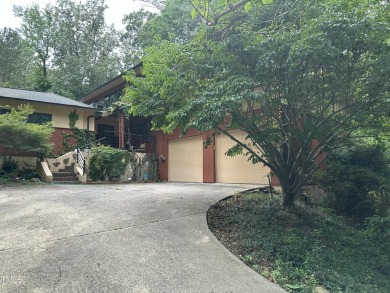 Discover this architecturally stunning 3-bedroom, 2.5-bath on Governors Club in North Carolina - for sale on GolfHomes.com, golf home, golf lot