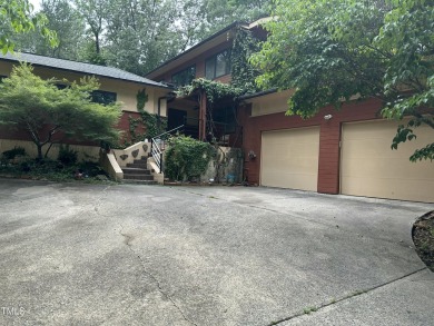 Discover this architecturally stunning 3-bedroom, 2.5-bath on Governors Club in North Carolina - for sale on GolfHomes.com, golf home, golf lot