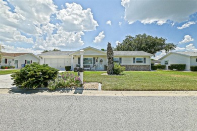 This beautifully updated expanded pecan model in Spruce Creek on The Links of Spruce Creek in Florida - for sale on GolfHomes.com, golf home, golf lot