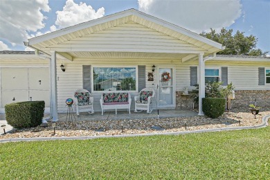 This beautifully updated expanded pecan model in Spruce Creek on The Links of Spruce Creek in Florida - for sale on GolfHomes.com, golf home, golf lot
