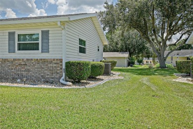 This beautifully updated expanded pecan model in Spruce Creek on The Links of Spruce Creek in Florida - for sale on GolfHomes.com, golf home, golf lot