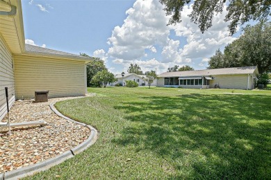 This beautifully updated expanded pecan model in Spruce Creek on The Links of Spruce Creek in Florida - for sale on GolfHomes.com, golf home, golf lot