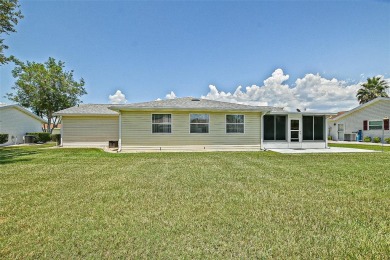 This beautifully updated expanded pecan model in Spruce Creek on The Links of Spruce Creek in Florida - for sale on GolfHomes.com, golf home, golf lot