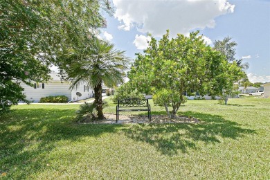 This beautifully updated expanded pecan model in Spruce Creek on The Links of Spruce Creek in Florida - for sale on GolfHomes.com, golf home, golf lot