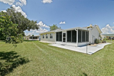 This beautifully updated expanded pecan model in Spruce Creek on The Links of Spruce Creek in Florida - for sale on GolfHomes.com, golf home, golf lot