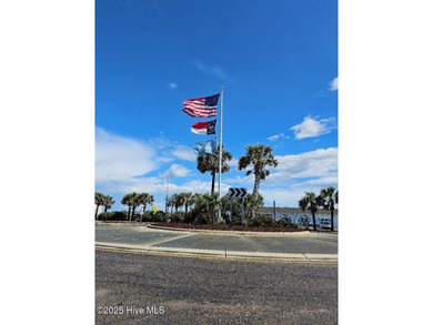 If you've been watching for the perfect coastal home, this on Brick Landing Plantation Yacht and Golf Club in North Carolina - for sale on GolfHomes.com, golf home, golf lot