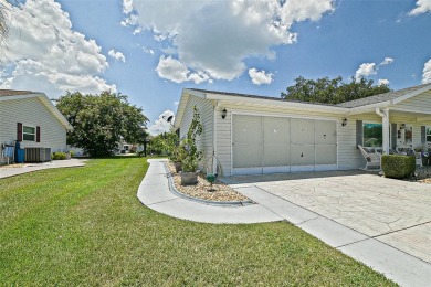 This beautifully updated expanded pecan model in Spruce Creek on The Links of Spruce Creek in Florida - for sale on GolfHomes.com, golf home, golf lot