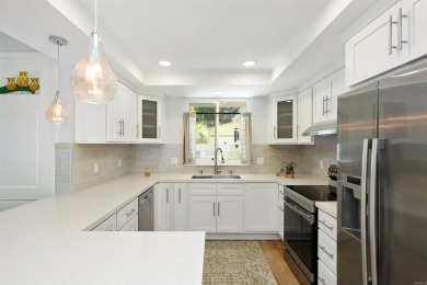 Welcome to this beautifully transformed and private end-unit on Laguna Woods Village Golf Course in California - for sale on GolfHomes.com, golf home, golf lot