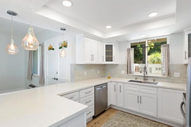 Welcome to this beautifully transformed and private end-unit on Laguna Woods Village Golf Course in California - for sale on GolfHomes.com, golf home, golf lot