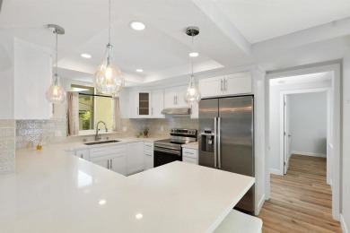 Welcome to this beautifully transformed and private end-unit on Laguna Woods Village Golf Course in California - for sale on GolfHomes.com, golf home, golf lot