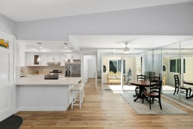 Welcome to this beautifully transformed and private end-unit on Laguna Woods Village Golf Course in California - for sale on GolfHomes.com, golf home, golf lot