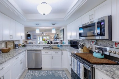Completely remodeled ground floor end unit 2/2 with den and one on Kelly Greens Golf and Country Club in Florida - for sale on GolfHomes.com, golf home, golf lot