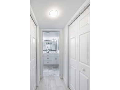Completely remodeled ground floor end unit 2/2 with den and one on Kelly Greens Golf and Country Club in Florida - for sale on GolfHomes.com, golf home, golf lot