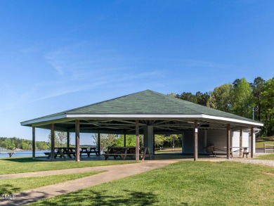 Step into timeless elegance with this gorgeous one and a half on River Golf and County Club at Lake Royale in North Carolina - for sale on GolfHomes.com, golf home, golf lot