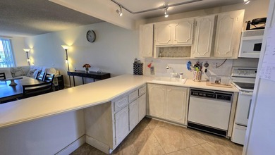 Enjoy serene lake views from this bright and spacious 3-bedroom on Palm-Aire Country Club and Resort - Palms in Florida - for sale on GolfHomes.com, golf home, golf lot