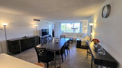 Enjoy serene lake views from this bright and spacious 3-bedroom on Palm-Aire Country Club and Resort - Palms in Florida - for sale on GolfHomes.com, golf home, golf lot