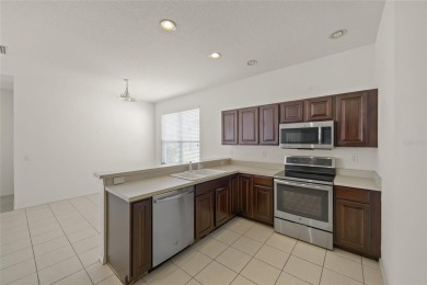 SAY HELLO TO A GOOD BUY * NEW ROOF DECEMBER 2020 * Enjoy the on Tatum Ridge Golf Links in Florida - for sale on GolfHomes.com, golf home, golf lot