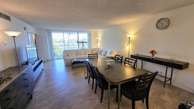 Enjoy serene lake views from this bright and spacious 3-bedroom on Palm-Aire Country Club and Resort - Palms in Florida - for sale on GolfHomes.com, golf home, golf lot