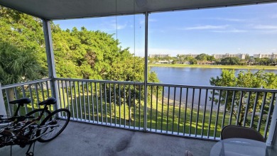 Enjoy serene lake views from this bright and spacious 3-bedroom on Palm-Aire Country Club and Resort - Palms in Florida - for sale on GolfHomes.com, golf home, golf lot