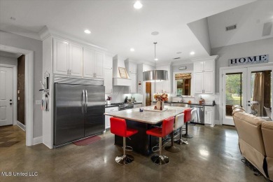 Tucked away in a quiet cul-de-sac within the highly desired on Colonial Country Club Deerfield in Mississippi - for sale on GolfHomes.com, golf home, golf lot