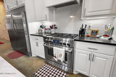 Tucked away in a quiet cul-de-sac within the highly desired on Colonial Country Club Deerfield in Mississippi - for sale on GolfHomes.com, golf home, golf lot