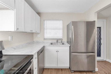 TURNKEY! NEWLY RENOVATED! Welcome to your dream home in the on Sunrise Lakes Phase III in Florida - for sale on GolfHomes.com, golf home, golf lot