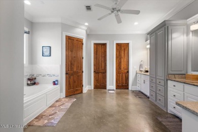 Tucked away in a quiet cul-de-sac within the highly desired on Colonial Country Club Deerfield in Mississippi - for sale on GolfHomes.com, golf home, golf lot