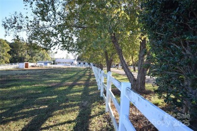 This lot is located in an artfully designed full service on Rock Barn Golf and Spa in North Carolina - for sale on GolfHomes.com, golf home, golf lot