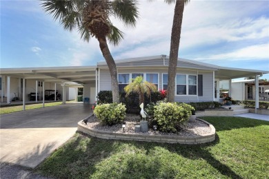 Under contract-accepting backup offers. The curb appeal of this on Maple Leaf Golf and Country Club in Florida - for sale on GolfHomes.com, golf home, golf lot