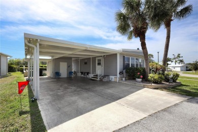 Under contract-accepting backup offers. The curb appeal of this on Maple Leaf Golf and Country Club in Florida - for sale on GolfHomes.com, golf home, golf lot