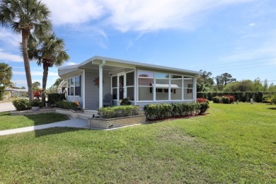 Under contract-accepting backup offers. The curb appeal of this on Maple Leaf Golf and Country Club in Florida - for sale on GolfHomes.com, golf home, golf lot