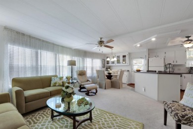 Under contract-accepting backup offers. The curb appeal of this on Maple Leaf Golf and Country Club in Florida - for sale on GolfHomes.com, golf home, golf lot