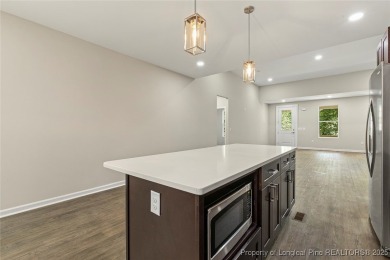 This lovely new construction home is located in the friendly on Carolina Trace Country Club in North Carolina - for sale on GolfHomes.com, golf home, golf lot