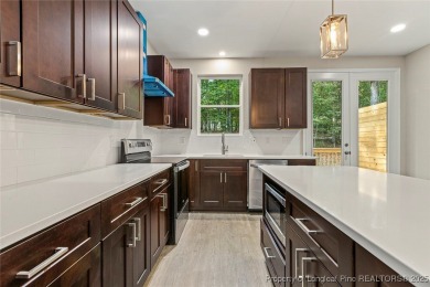This lovely new construction home is located in the friendly on Carolina Trace Country Club in North Carolina - for sale on GolfHomes.com, golf home, golf lot
