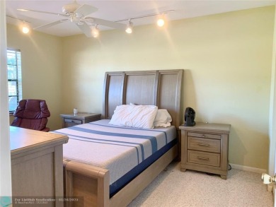 Amazing two bedroom, two and a half bath, guard gated townhouse on Boca Lago Golf and Country Club in Florida - for sale on GolfHomes.com, golf home, golf lot