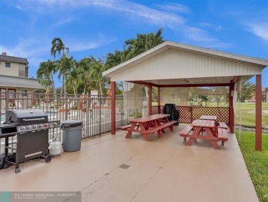 JUST SIT ON YOU SCREENED BALCONY AND ENJOY THIS BEAUTIFUL VIEW on Lauderhill Golf Course in Florida - for sale on GolfHomes.com, golf home, golf lot