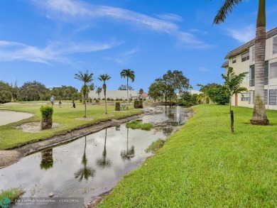 JUST SIT ON YOU SCREENED BALCONY AND ENJOY THIS BEAUTIFUL VIEW on Lauderhill Golf Course in Florida - for sale on GolfHomes.com, golf home, golf lot