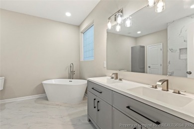 This lovely new construction home is located in the friendly on Carolina Trace Country Club in North Carolina - for sale on GolfHomes.com, golf home, golf lot